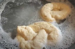 Boiling Homemade Soft Pretzels in Baking Soda Water in a Wok