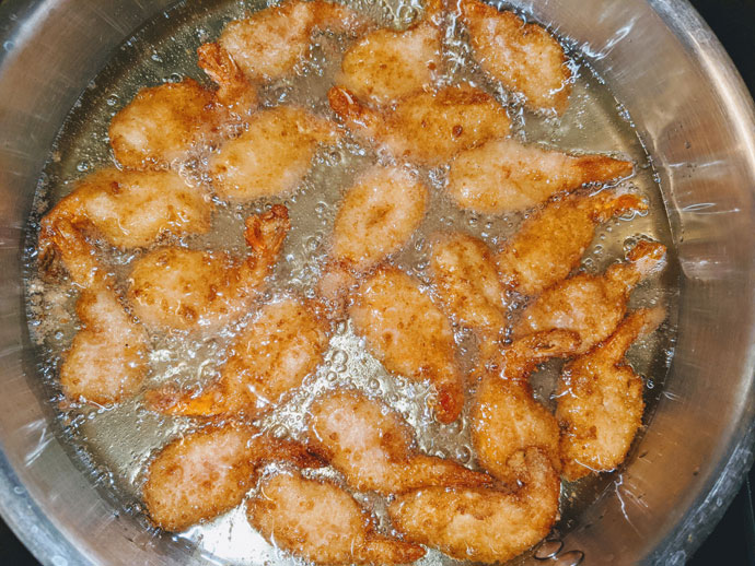 Golden Fried Shrimp in a Pan with Oil