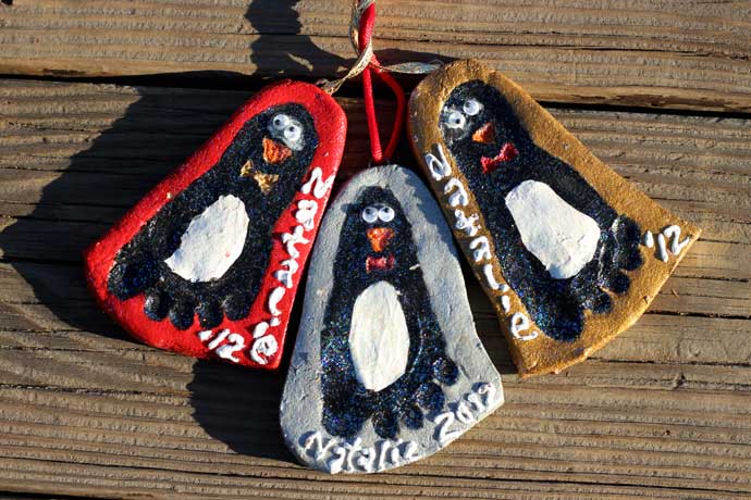 Perfect Penguin Footprint Salt Dough Ornaments - Red, Silver, & Gold Clay ornaments with black and white footprint penguins